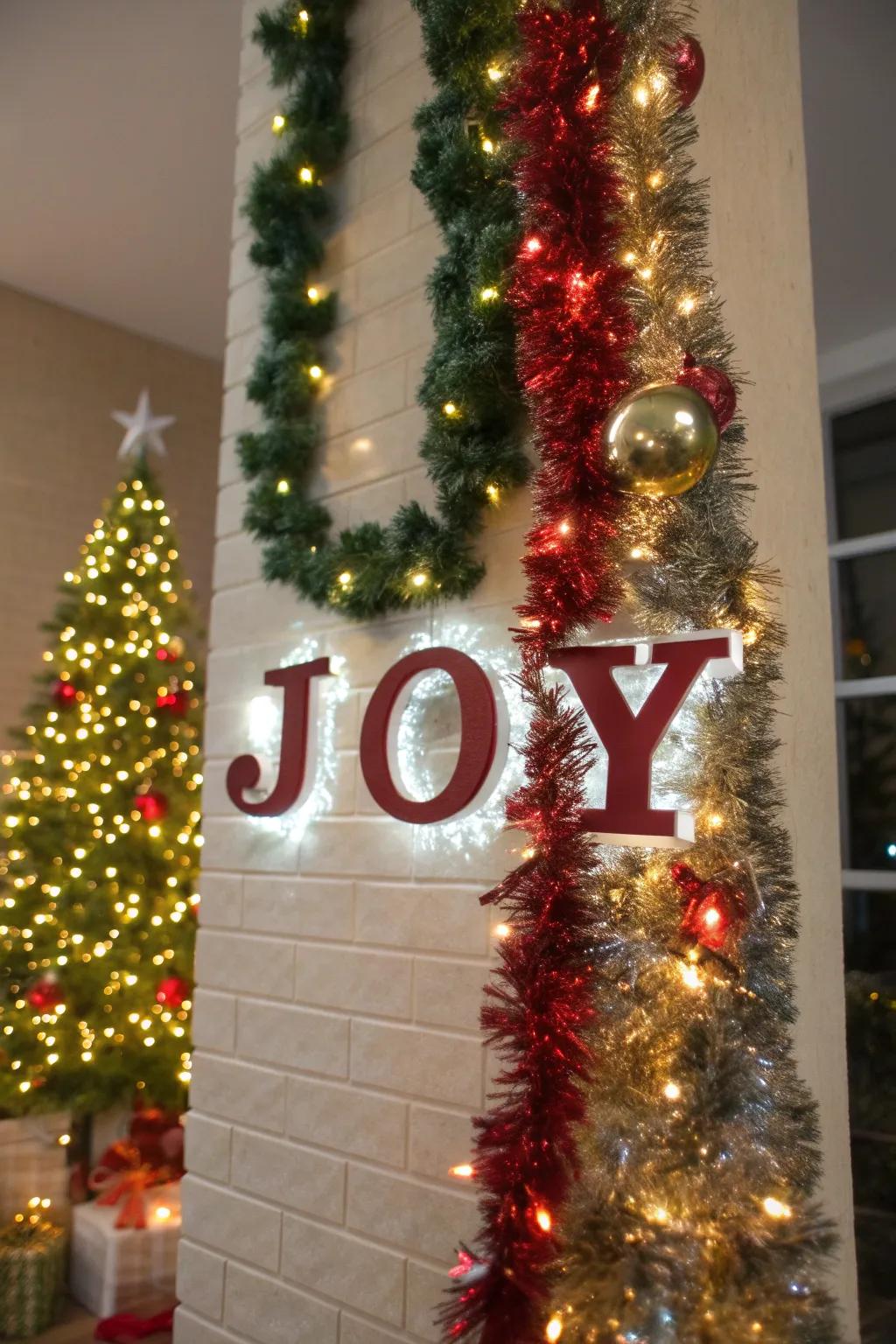 Sparkle ribbon mural art spells out 'JOY,' bestowing a playful element to holiday decor.