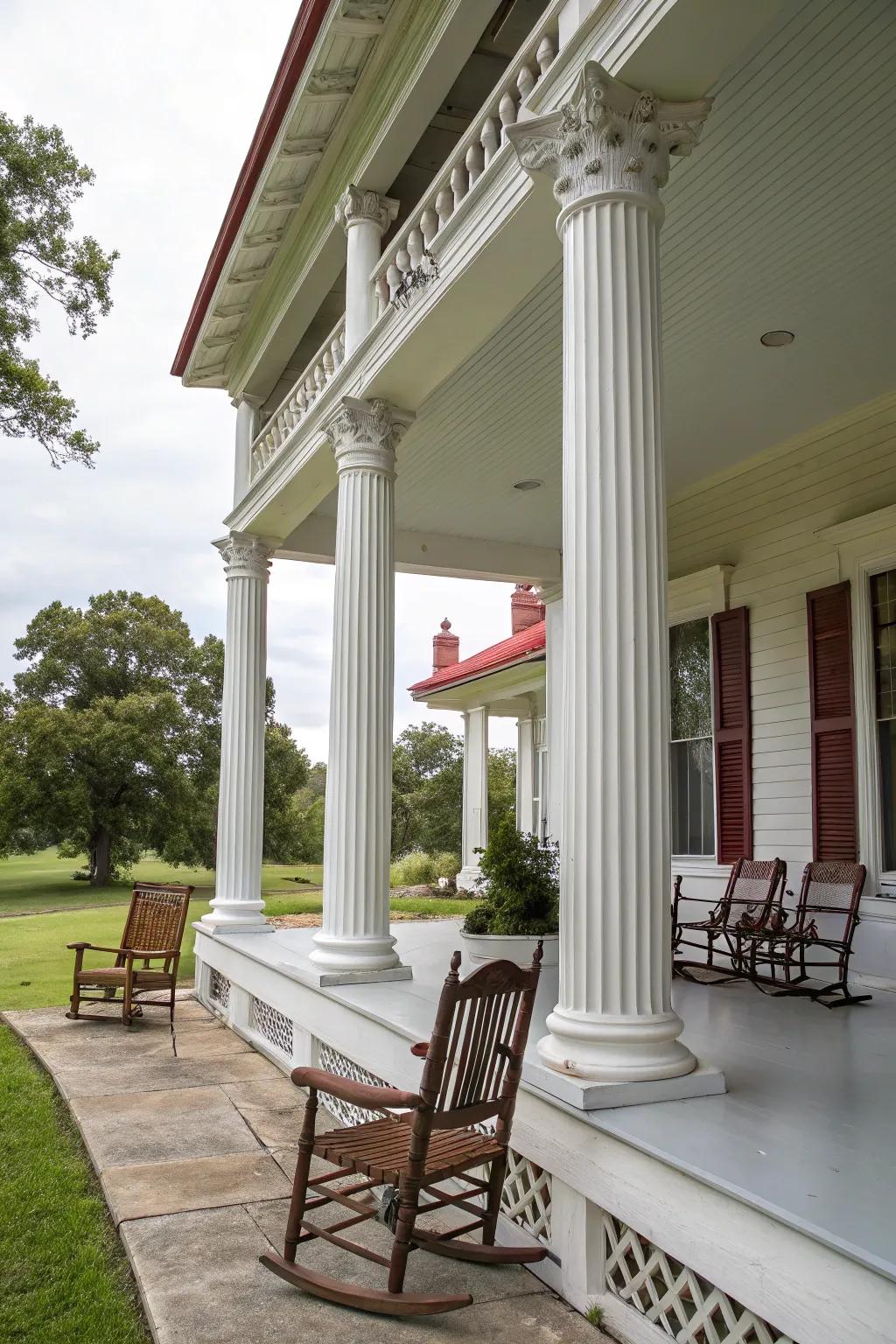 Colonial home boasting a refined veranda supported by pillars.