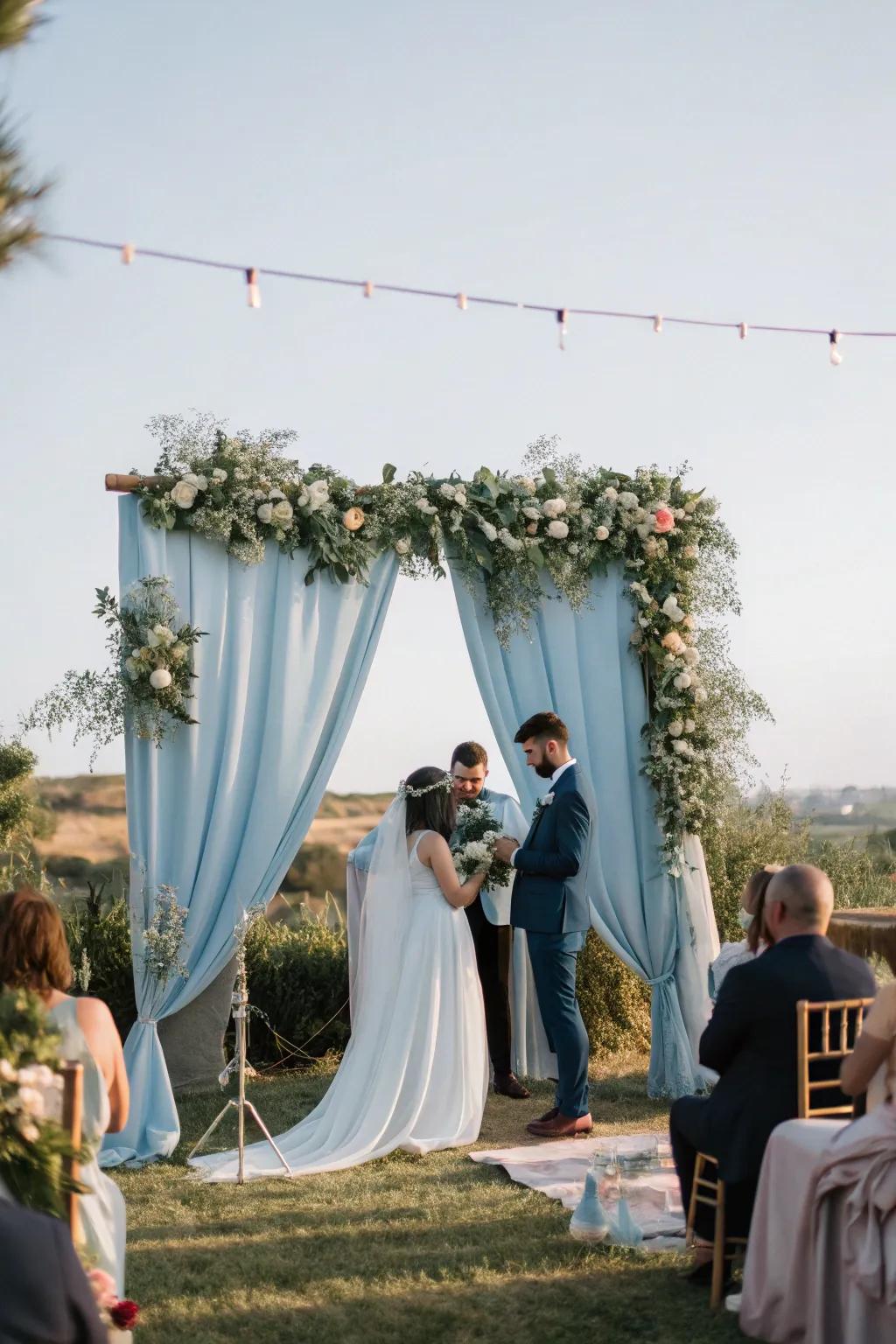 A whimsical ceremony space showcasing a soft teal backdrop that enhances the romantic atmosphere.