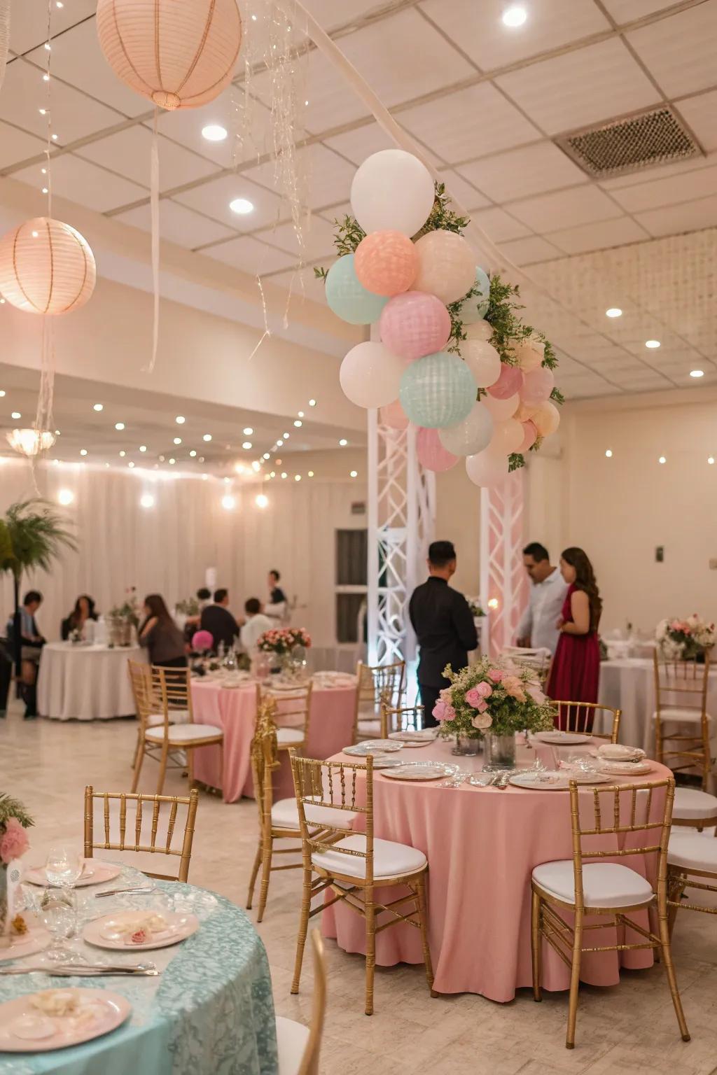 A dreamy indoor party featuring soft decorations and table settings.
