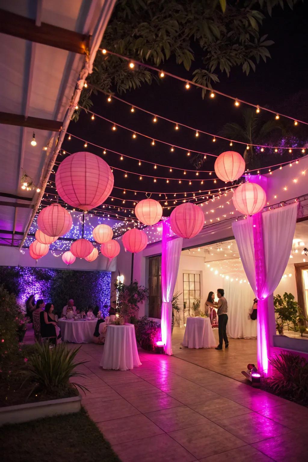 Soft pink lighting casts a magical glow over the celebration.