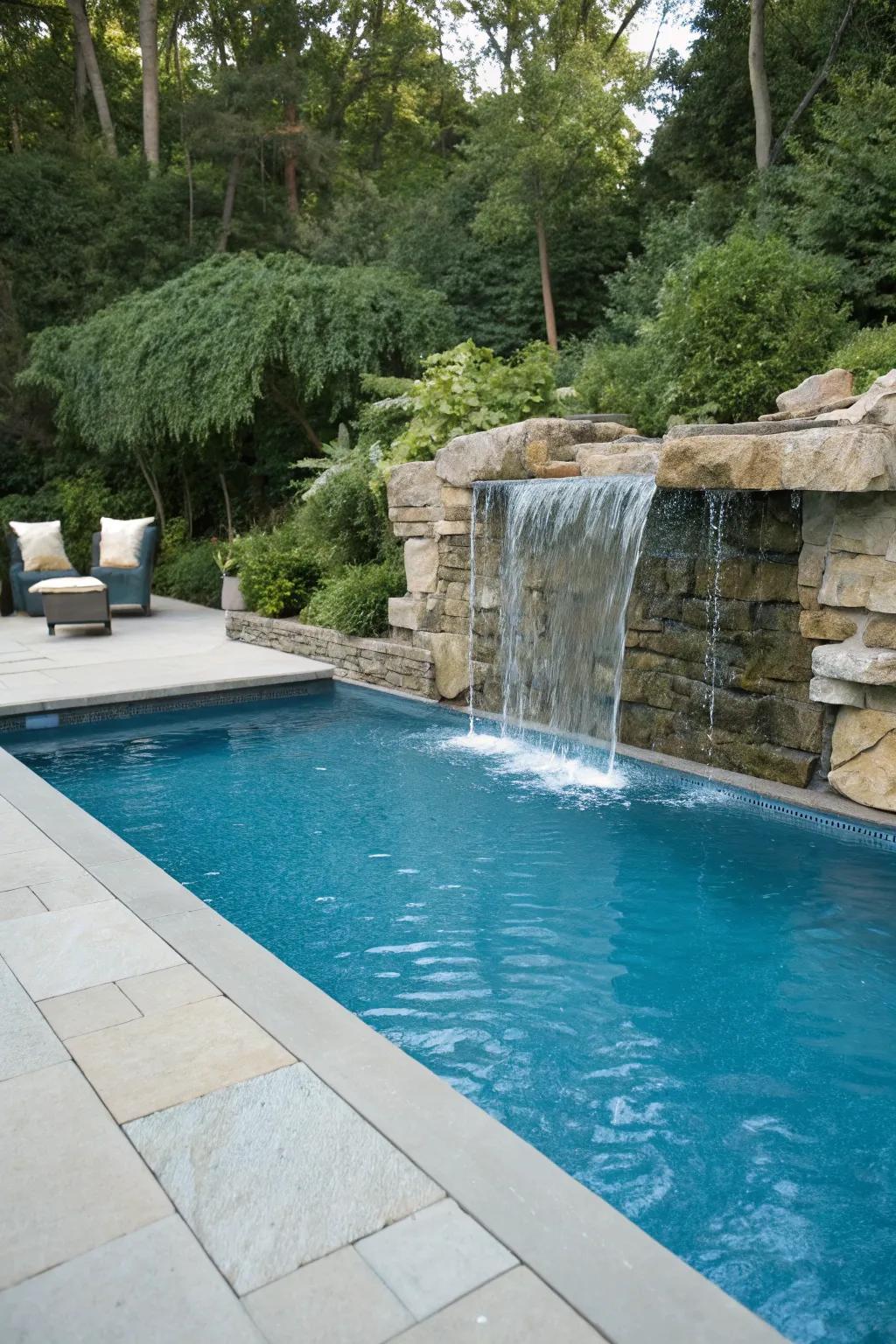 A waterfall element includes style and calm to the pool.