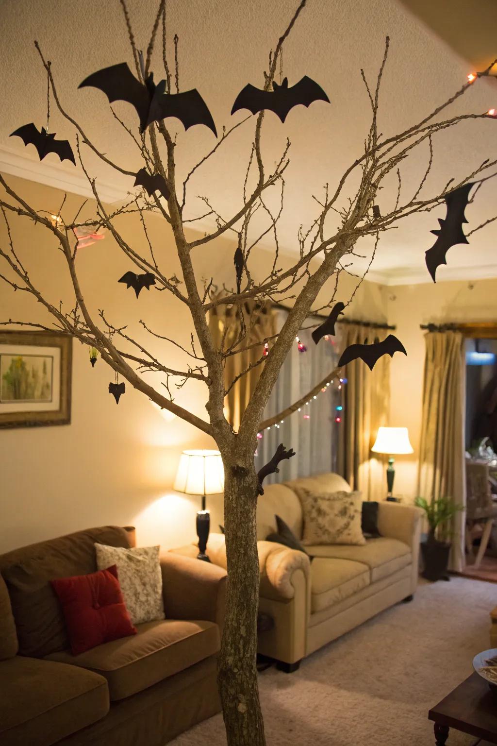 A spooky Halloween tree adorned with fluttering chiroptera.