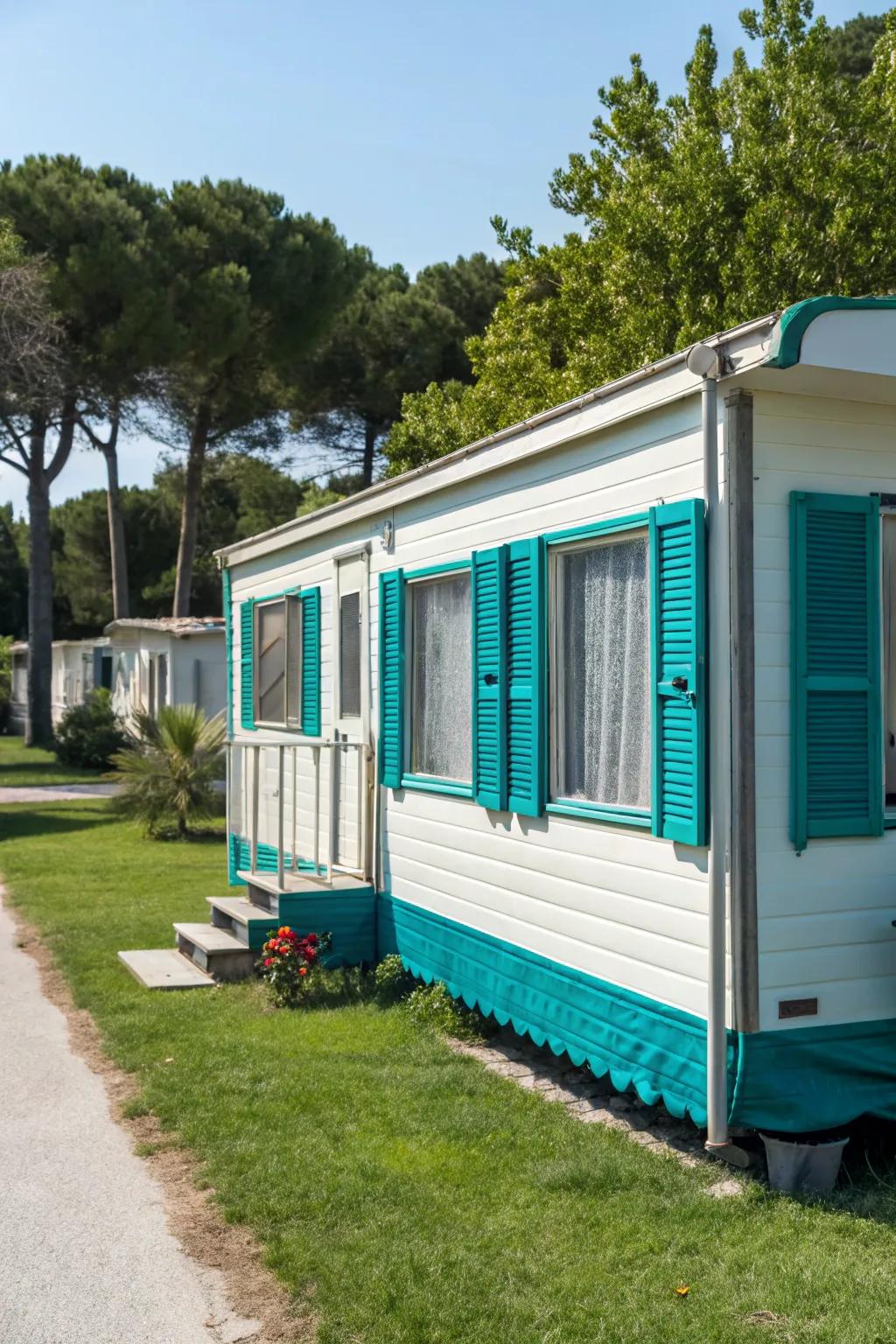 Teal shutters contributing a burst of color to a manufactured home.