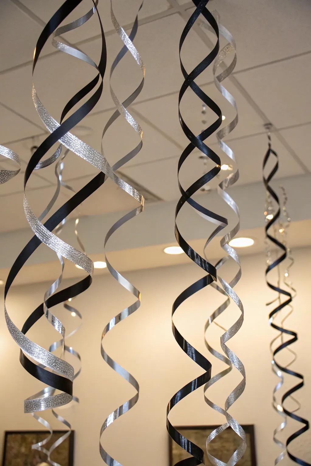 Glistening onyx and argent ribbons establish a celebratory atmosphere.