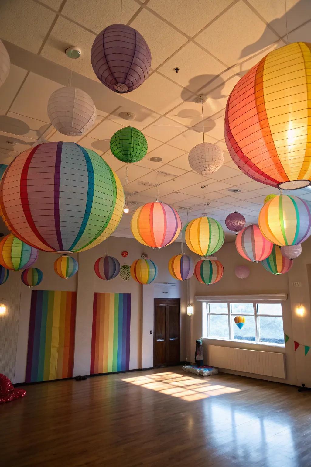 A party room decorated with vibrant spectral paper globes.
