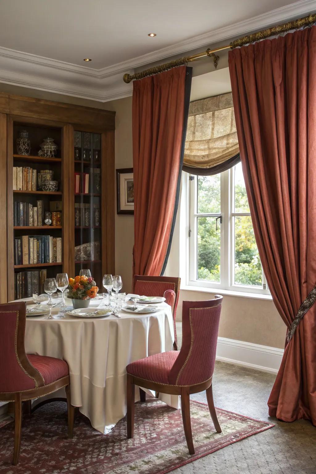 Lavish drapes infuse drama and charm into a compact dining area.