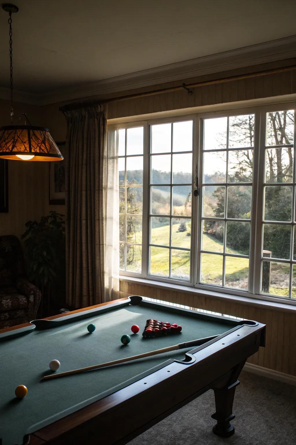 Natural light floods the pool table room, enhancing its warmth and openness.