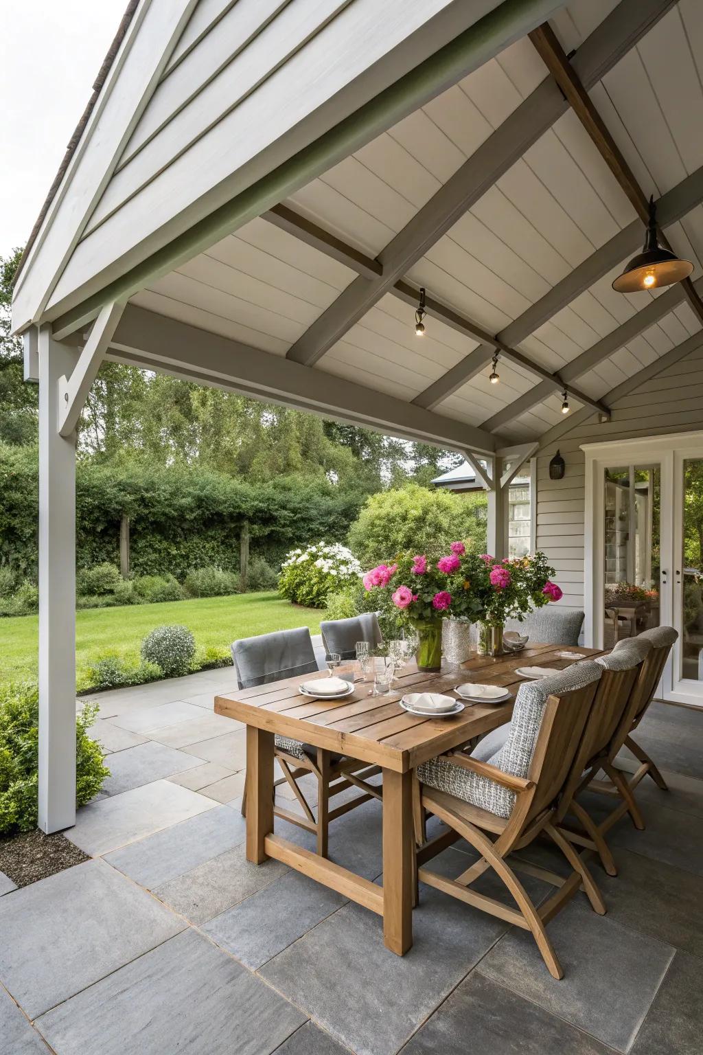A porch expansion with a dining area under a roof extension.