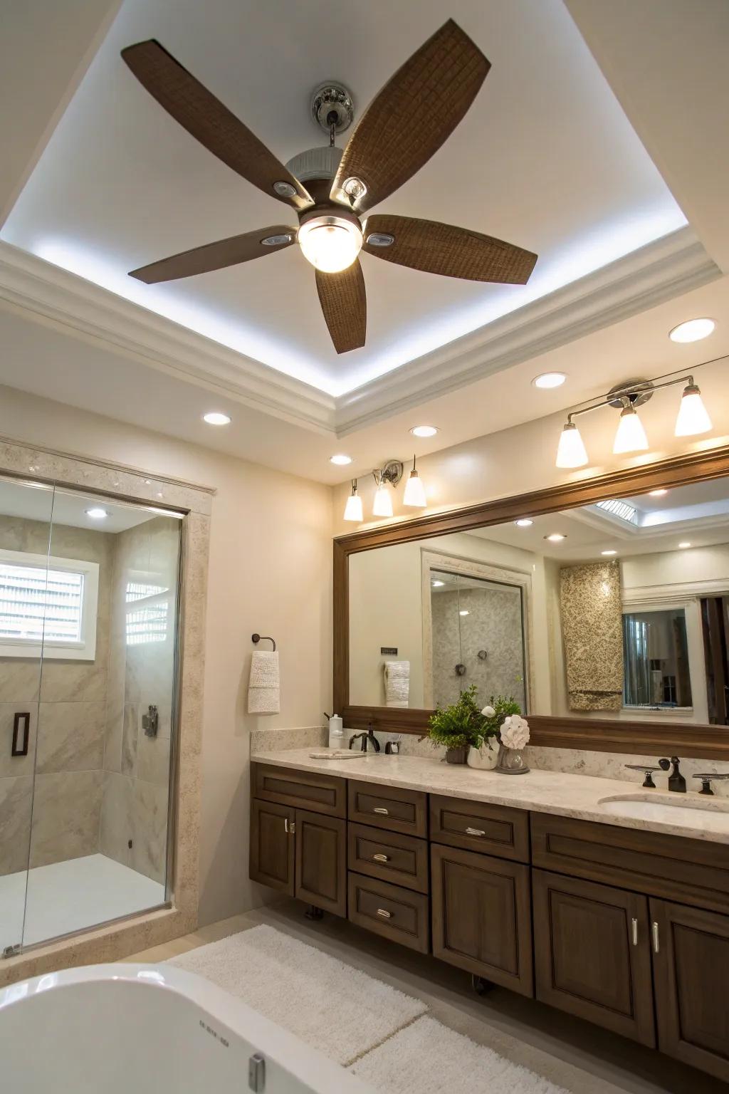 A sophisticated bathroom that presents a ceiling ventilator with recessed lighting.