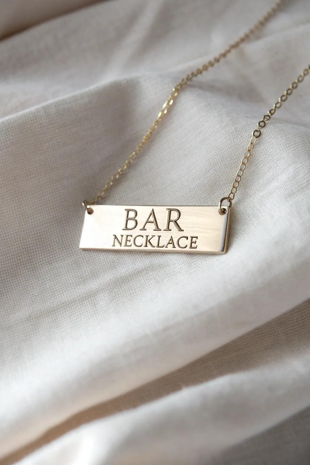 A modern plaque necklace featuring personalized inscriptions.