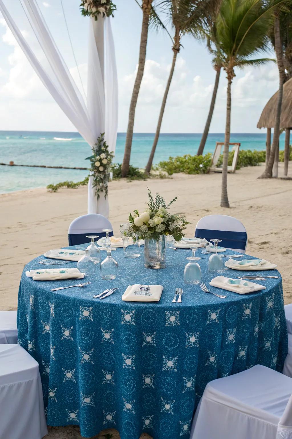 Ocean-themed table covering for a tranquil seaside wedding.